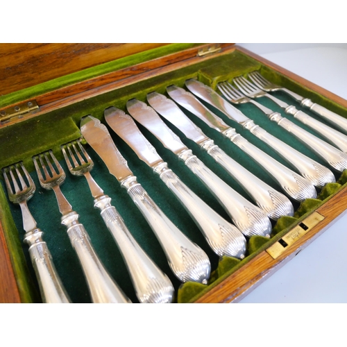 663 - A set of six silver plated fish knives and forks in a wooden presentation box, Christopher Johnson a... 