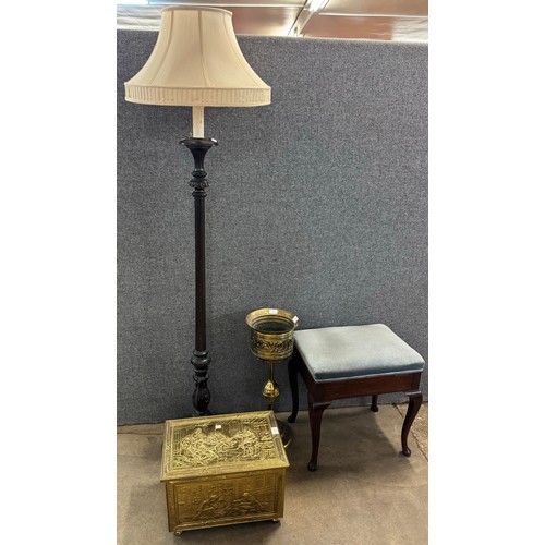 252 - A carved oak standard lamp, a brass ice bucket, brass log bin and piano stool