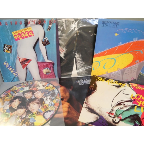 679 - Eleven Rolling Stones and related LP records including Sticky Fingers zip cover and a 1990 tour prog... 