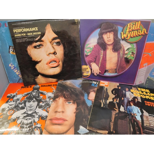 679 - Eleven Rolling Stones and related LP records including Sticky Fingers zip cover and a 1990 tour prog... 