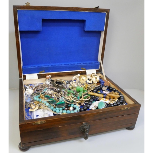 688 - A wooden box with costume jewellery