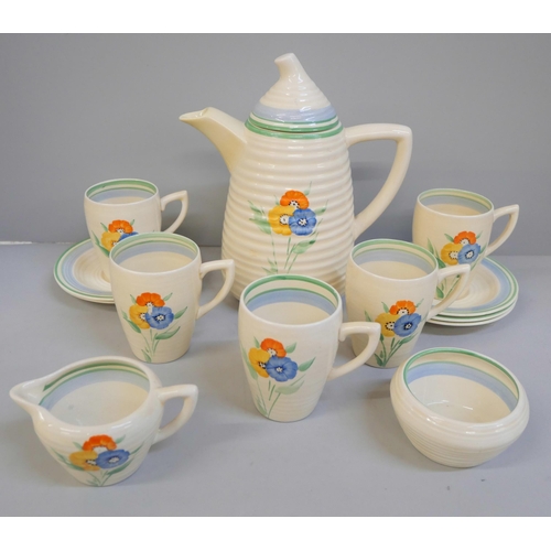 698 - A Wilkinsons Clarice Cliff Lynton shaped coffee set, five setting, tiny chip to one cup and saucer b... 