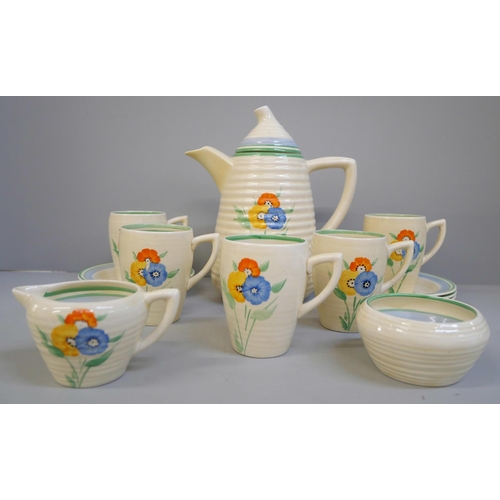 698 - A Wilkinsons Clarice Cliff Lynton shaped coffee set, five setting, tiny chip to one cup and saucer b... 