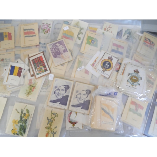 701 - A collection of silk cigarette cards including large