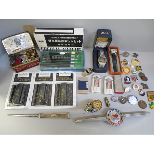 702 - Watches, lighters, etc., and a tin of enamel  and badges including many bowling and a German WWII sh... 