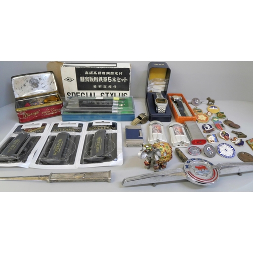 702 - Watches, lighters, etc., and a tin of enamel  and badges including many bowling and a German WWII sh... 