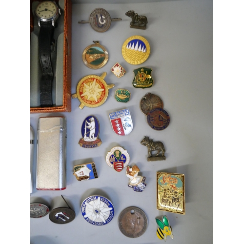 702 - Watches, lighters, etc., and a tin of enamel  and badges including many bowling and a German WWII sh... 