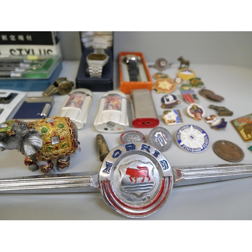 702 - Watches, lighters, etc., and a tin of enamel  and badges including many bowling and a German WWII sh... 