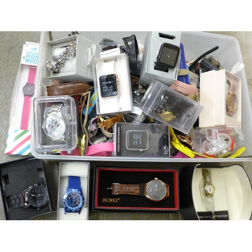 712 - A large collection of wristwatches including digital and some boxed