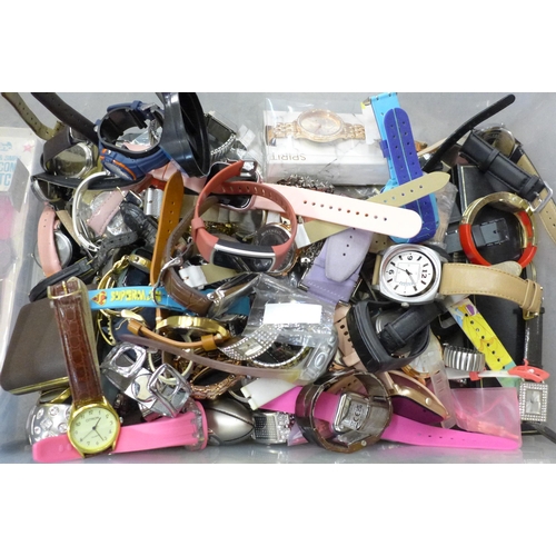 712 - A large collection of wristwatches including digital and some boxed