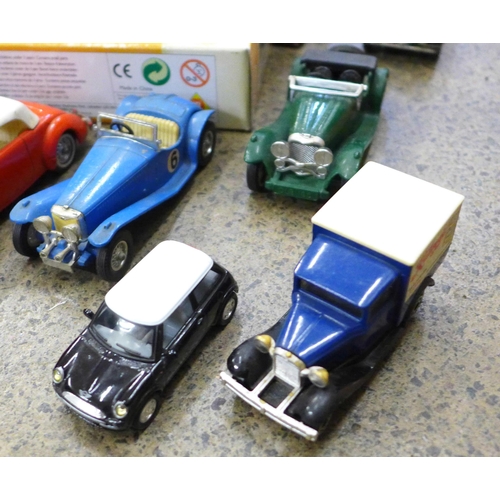 718 - A collection of model cars and vans including Corgi, Mercedes 300c and Corgi Jaguar XK120