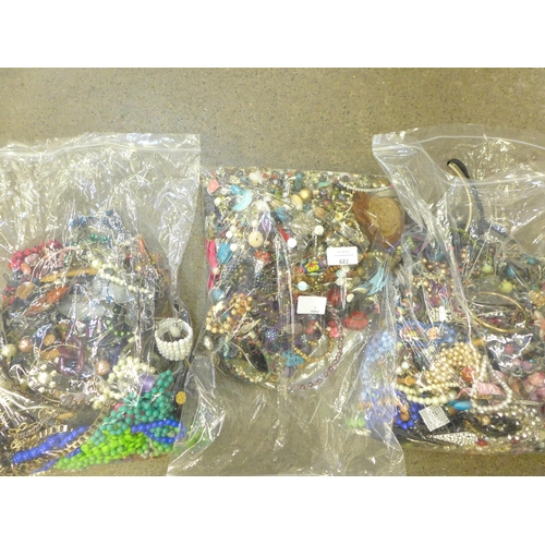 729 - Three bags of costume jewellery