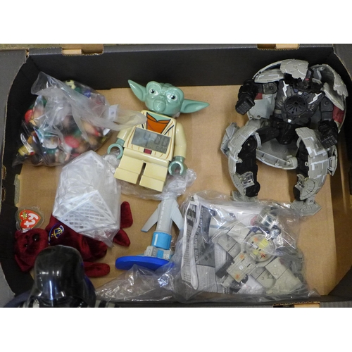 739 - A collection of toys including a Star Wars Death Star, a Dr Who Tardis, Yoda alarm clock, Darth Vade... 