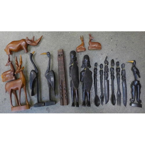 740 - A collection of carved wooden tourist items including four deer, rhino, two figures, three birds