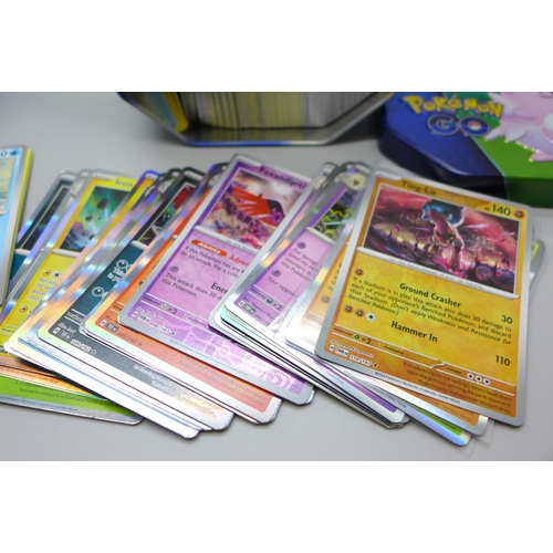 746 - Large quantity of Pokemon cards in two collectors tins, approximetely 600 cards, including Holograph... 