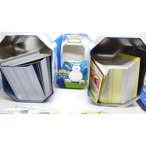 746 - Large quantity of Pokemon cards in two collectors tins, approximetely 600 cards, including Holograph... 