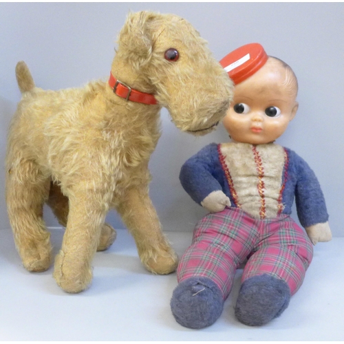 750 - A Palitoy 1930's Bell Boy and a straw filled Terrier dog