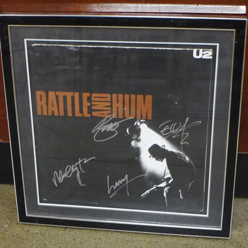 786 - A U2 signed LP display with COA to back of frame