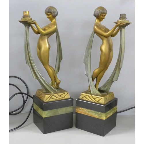 801 - A pair of early 20th Century Art Deco cold painted spelter figures, with marble and onyx bases, sign... 