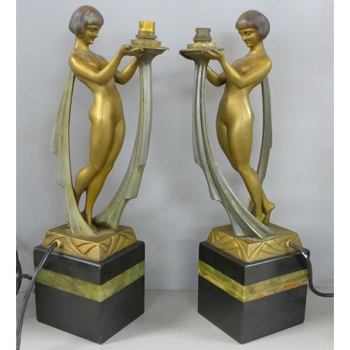 801 - A pair of early 20th Century Art Deco cold painted spelter figures, with marble and onyx bases, sign... 