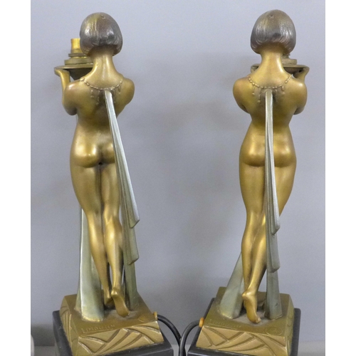 801 - A pair of early 20th Century Art Deco cold painted spelter figures, with marble and onyx bases, sign... 