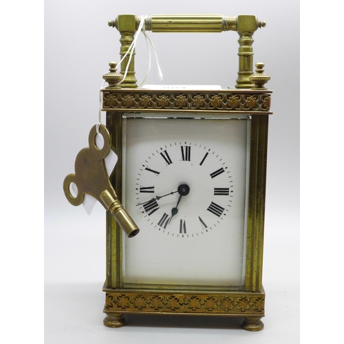 804 - A brass and four glass sided carriage clock with cylinder escapement