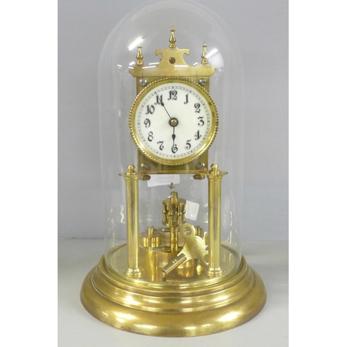 806 - A German anniversary clock with disc pendulum, key included **PLEASE NOTE THIS LOT IS NOT ELIGIBLE F... 