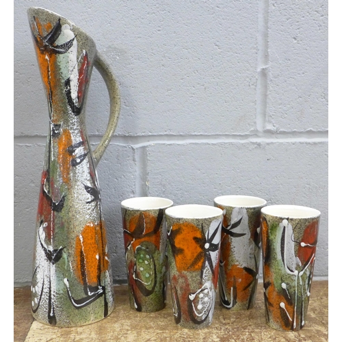 809 - A 1960's pitcher and four beakers