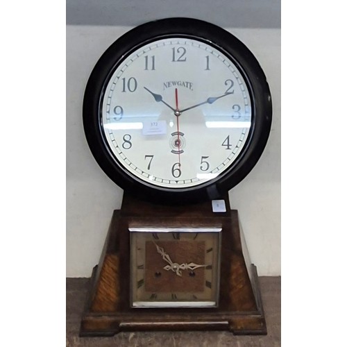 372 - An Art Deco oak mantle clock and a Newgate metal wall clock