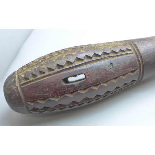 815 - An African tribal club and a carved club or walking cane top in the form a clenched hand