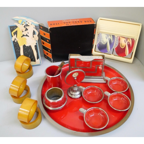 825 - A 1930s Bridge card set and tray and Rolinx roll-top card box with two packs of playing cards, seale... 