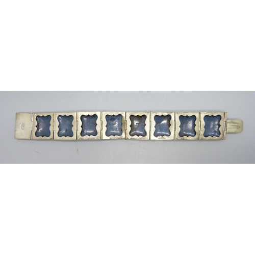 830 - An enamel panel bracelet with hand painted decoration, one panel frame a/f, 19cm