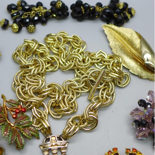 890 - A collection of costume jewellery including paste set brooches