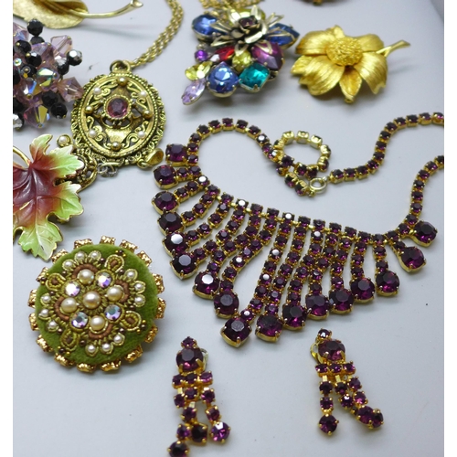 890 - A collection of costume jewellery including paste set brooches