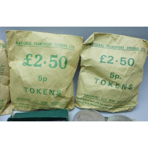 897 - Three bags of national transport tokens, together with coins including crowns