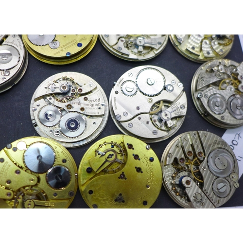 913 - A collection of pocket watch movements and dials, including Waltham, J.W Benson, Elgin, etc.