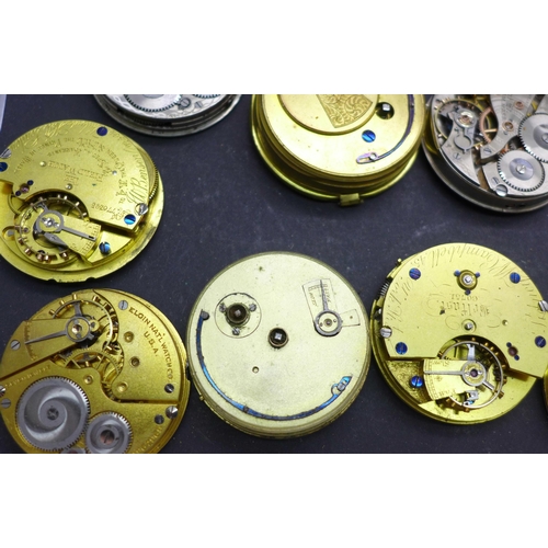 913 - A collection of pocket watch movements and dials, including Waltham, J.W Benson, Elgin, etc.