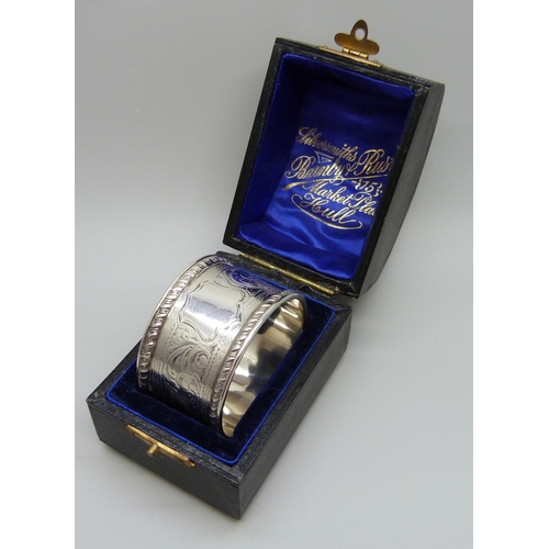 923 - A silver napkin ring with engraved decoration, Chester hallmark worn, 27g, cased