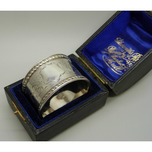 923 - A silver napkin ring with engraved decoration, Chester hallmark worn, 27g, cased