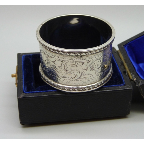 923 - A silver napkin ring with engraved decoration, Chester hallmark worn, 27g, cased