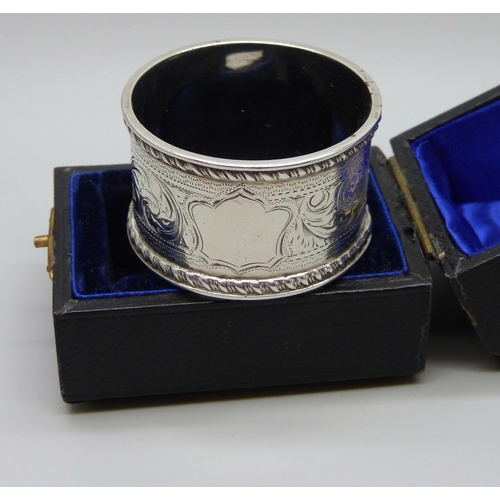 923 - A silver napkin ring with engraved decoration, Chester hallmark worn, 27g, cased