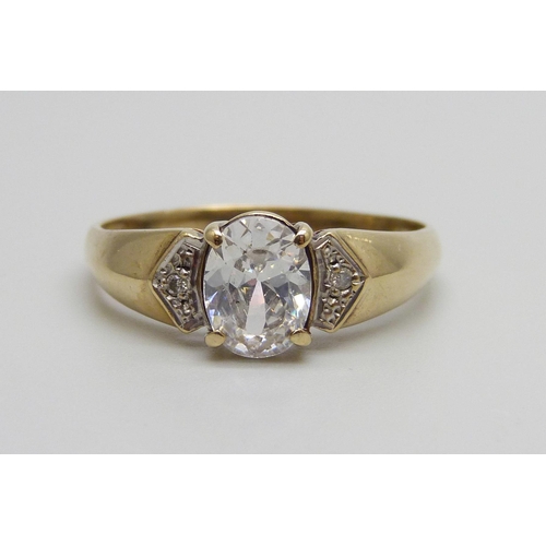 932 - A 9ct gold ring set with a white central stone and small diamonds, 2.7g, W