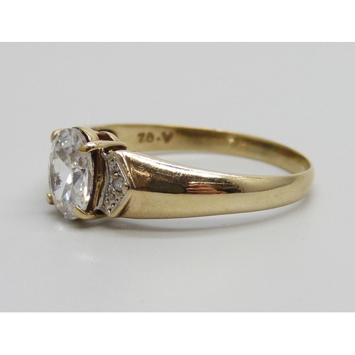 932 - A 9ct gold ring set with a white central stone and small diamonds, 2.7g, W