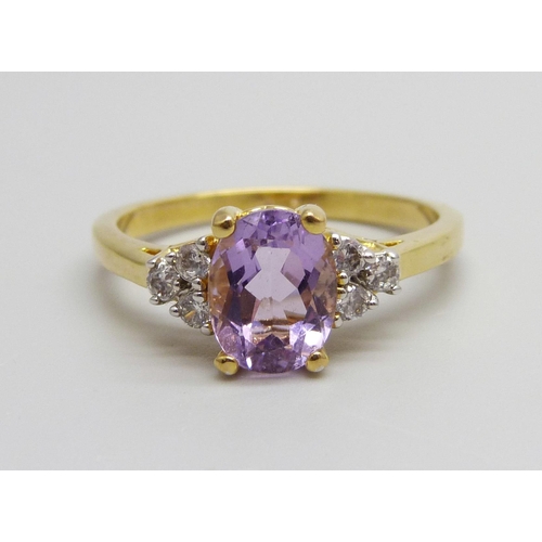 940 - A silver gilt, amethyst and white stone ring, V/W