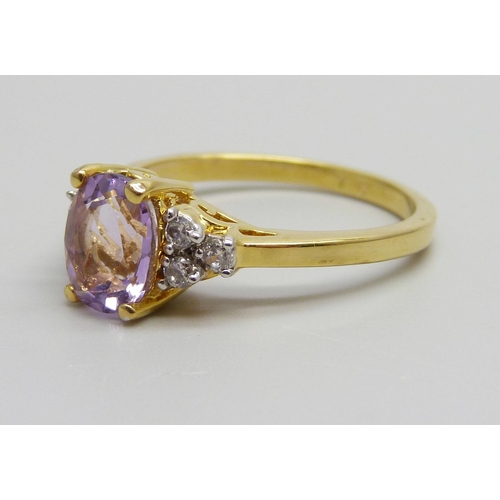 940 - A silver gilt, amethyst and white stone ring, V/W