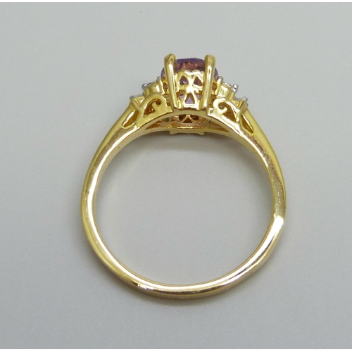 940 - A silver gilt, amethyst and white stone ring, V/W