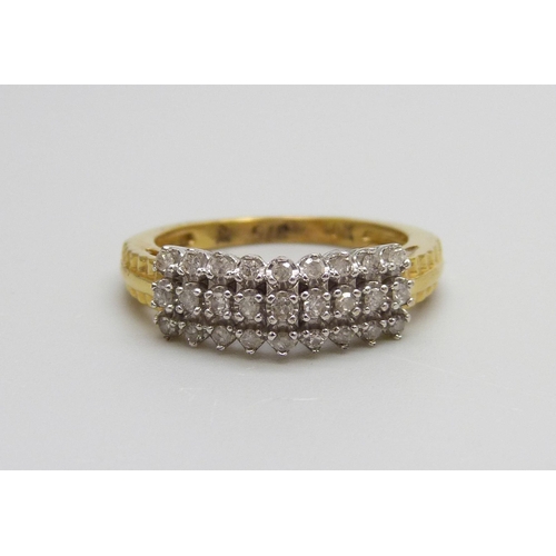 941 - A 10k gold three row diamond ring set with 27 stones, 3g,  N/O