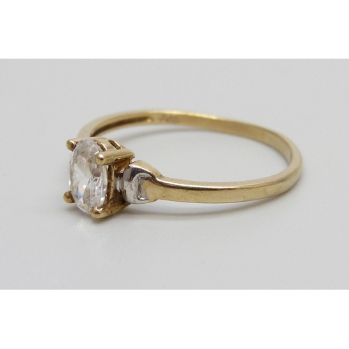 947 - A 9ct gold ring set with a white stone, 1.1g, N