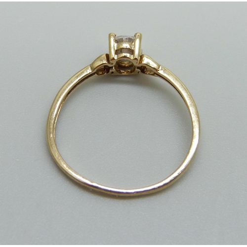 947 - A 9ct gold ring set with a white stone, 1.1g, N