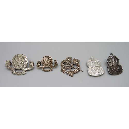 951 - Two silver ARP badges, two St John's Ambulance badges and a Boy's Brigade example